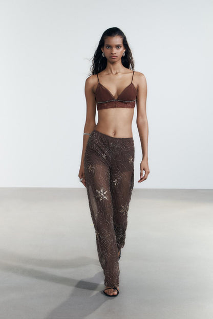 Pantalon transparent à sequins contrastés